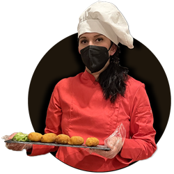 Chef Ioana Botis con unas crujientes croquetas caseras Foto de perfil de chef Ioana Botis